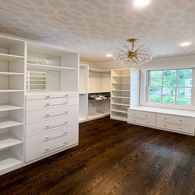 walk-in closet shoe shelves and peninsula drawers storage